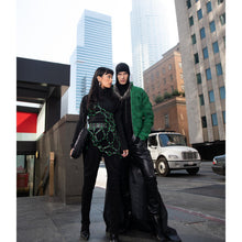 Load image into Gallery viewer, model wearing black brown emf mens hoodie and green jacket